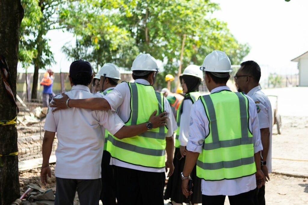 Construction team wearing hard hats and safety vests